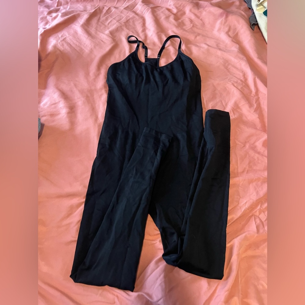 Pink unitard in black size small